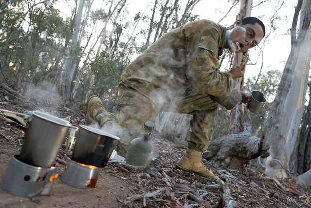 Australian Army officer trainee Staff Cadet Gaurav Saini from Royal Military College at Duntroon conducts morning routine during the field phase of his initial cadet training at Majura training area, Canberra, on 8 March 2016.