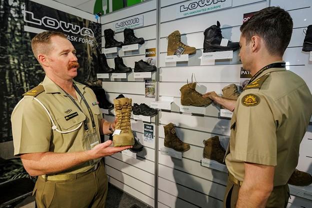 Australian Army soldiers inspect Lowa boots during Land Forces International Land Defence Exposition 2024 in Melbourne.