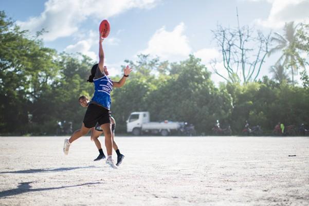 Nauru children playing Australian Rules Football