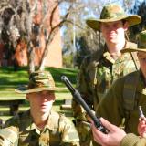 An Army Recruit Instructor giving a strip and assemble lesson to some recruits.