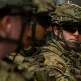 Army riflemen onboard a Royal Australian Air Force flight.