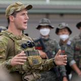 An Australian Army lieutenant briefs partner nations during a training exercise.