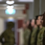 Soldiers standing in a corridor.