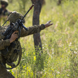A soldier delivers fire control orders.