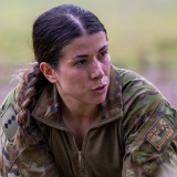 Soldier debriefs her team.