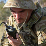 Soldier testing radio communications.