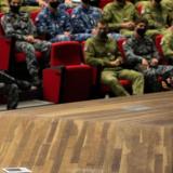 Australian Defence Force trainee officers are being talked to in a lecture hall.