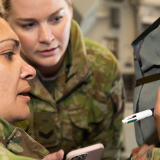 Soldiers writing a goodbye message.