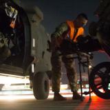 An Australian medical team assists in the aero medical evacuation.
