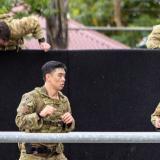 Australian Army soldiers engaging in a fitness training course.