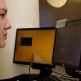 A signaller studies cyber defence operations on a computer.