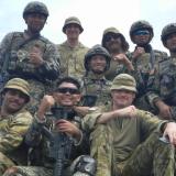 Soldiers from the Malaysian and Australian armies sit atop a Malaysian Army AV-8.