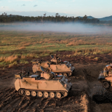 M1A1 Abrams Tanks cross an anti-tank ditch during combined unit training activity at Shoalwater Bay.