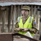 Camera team personnel conduct an interview.