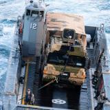 A Royal Australian Light Landing Craft transfers an Australian Army PMV.