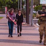 Australian Army Reserve soldiers from Battle Group Waratah interact with locals while patroling the main street of Ingham, Queensland while carrying out protection operations as part of Exercise Talisman Sabre 2023.