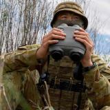 Australian Army soldiers observe the 81mm mortar impact area during an artillery forward observer course.