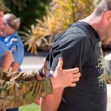 An Australian Army soldier searches a 'suspect' during a mock cordon and search operation.