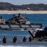 Australian Army soldiers and Bushmaster Protected Mobility Vehicles are loaded onto LHD Landing Crafts during the reconstitution of the Australian Amphibious Force during Exercise Sea Raider 2023.