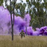 Australian Army officer Lieutenant William Mellor from 3rd Combat Service Support Battalion signals a supplies drop with a smoke grenade during Exercise Brolga Run, at Townsville Field Training Area, Queensland, on 01 June 2024.