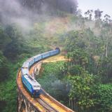 The Udarata Menike train traveling along the Nine Arch Bridge.