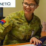 Soldier studying with Alto and QintetiQ logos