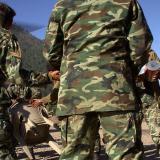 Australian and Pakistani soldiers team up to unload humanitarian supplies in the earthquake-devastated town of Dhanni.