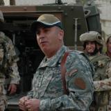 Centcom General John Abizaid (centre), was presented with a baseball hat with an Australian Army Rising Suns motif in Baghdad.