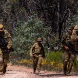 A section-strength patrol moves returns to its defensive position during a Junior Leaders Course at the Puckapunyal Military Training Area.