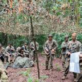 An Australian Army Officer debriefing soldiers after a patrol.