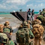 Australian Army soldiers conduct a bilateral amphibious landing.