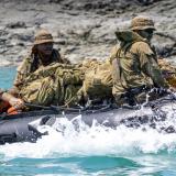An Australian Army captain and two soldiers on a reconnaissance and surveillance patrol.