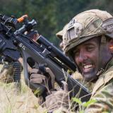 An Australian Army soldier reloads his weapon at a field firing range.