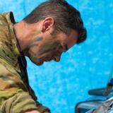 An Australian Army medic treating a simulated patient.