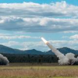Three Australian Army High Mobility Artillery Rocket System (HIMARS) launch rockets.
