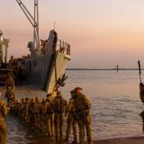 Australian Army soldiers board a United States Army Landing Craft Utility 2020 during Exercise Predator's Run.