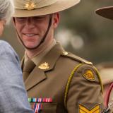 Australian Army Sergeant Kylie Guarino receives her King's Coronation Medal from Her Excellency Victoria Treadell CMG, MVO.