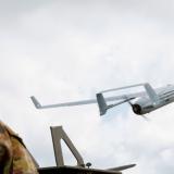 An Australian Army soldier launches an Integrator UAV.