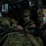 Soldiers being lifted by a MV-22B Osprey.