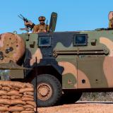Australian Army soldiers keep constant watch at a vehicle check point outside RAAF Base Curti.