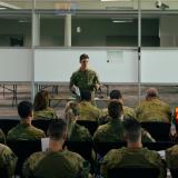 An officer delivers a brief to Australian Defence Force personnel.
