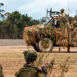 Australian Army soldiers from the 6th Battalion, The Royal Australian Regiment arrive at Exercise Diamond Run by Bushmaster Protected Mobility Vehicle, at Shoalwater Bay Training Area.