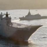 HMAS Canberra and JS Kumano sail into Sydney Harbour in the early morning for the Exercise Kakadu Fleet Review.