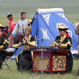 Mongolians perform throat singing during a mini-Naadam