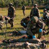 Australian Army soldiers simulate rendering first aid to casualties.