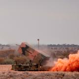 The National Advanced Surface to Air Missile System fires an AIM-120 Advanced Medium Range Air to Air Missile.