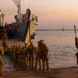 Australian Army soldiers board a United States Army Landing Craft Utility 2020 during Exercise Predator's Run.