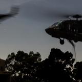 Australian Army UH-60M Black Hawks insert Australian Army soldiers onto a target.