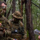 An Australian Army soldier receives orders from his platoon commander before a patrol.