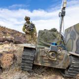 An Australian Army soldier from 1st Armoured Regiment with the 'Warfighter' uncrewed ground vehicle equipped with a prototype communications system during Project Convergence Capstone 5 at Fort Irwin, California, on 11 March 2025.